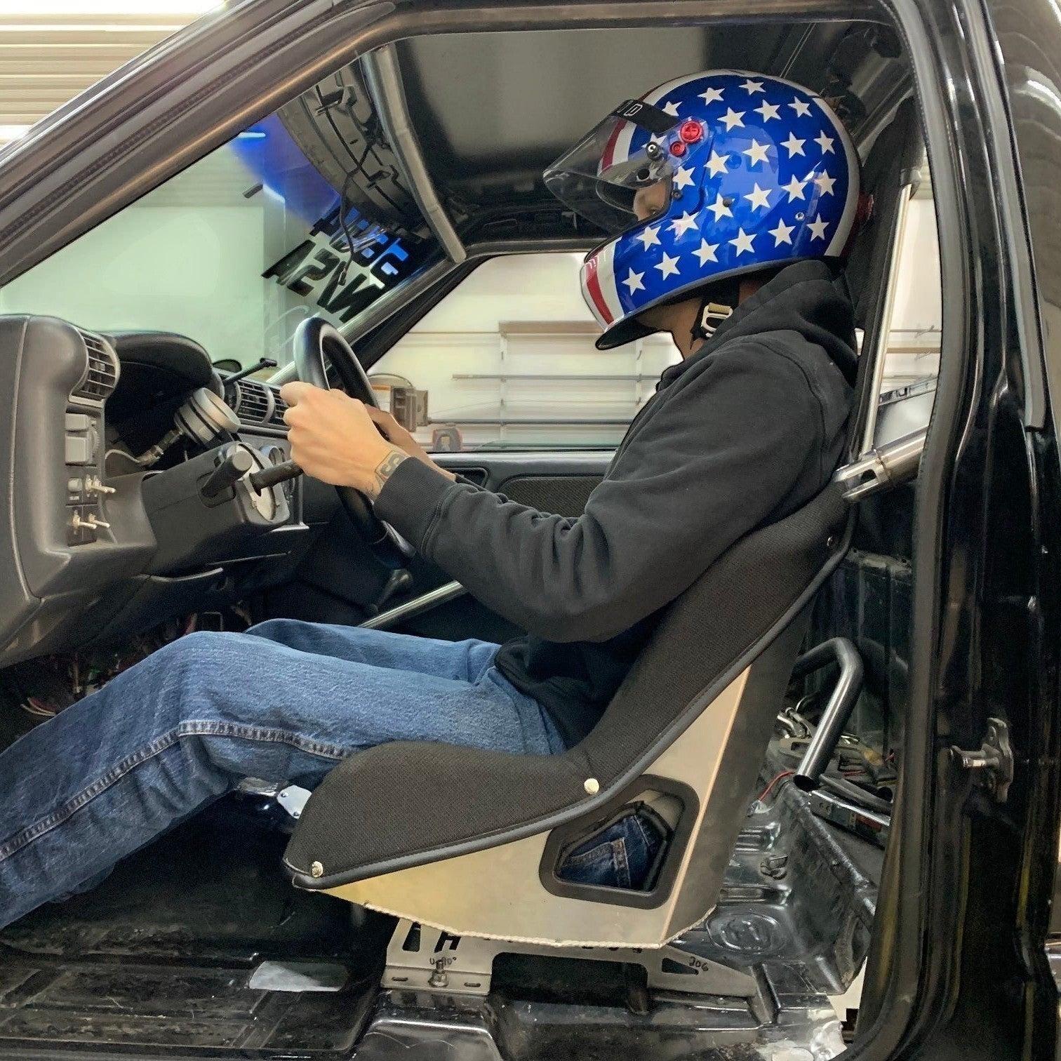 Henderson Race Shop seat mounts installed with a Kirkey high-back racing seat in a GM S-Series truck interior