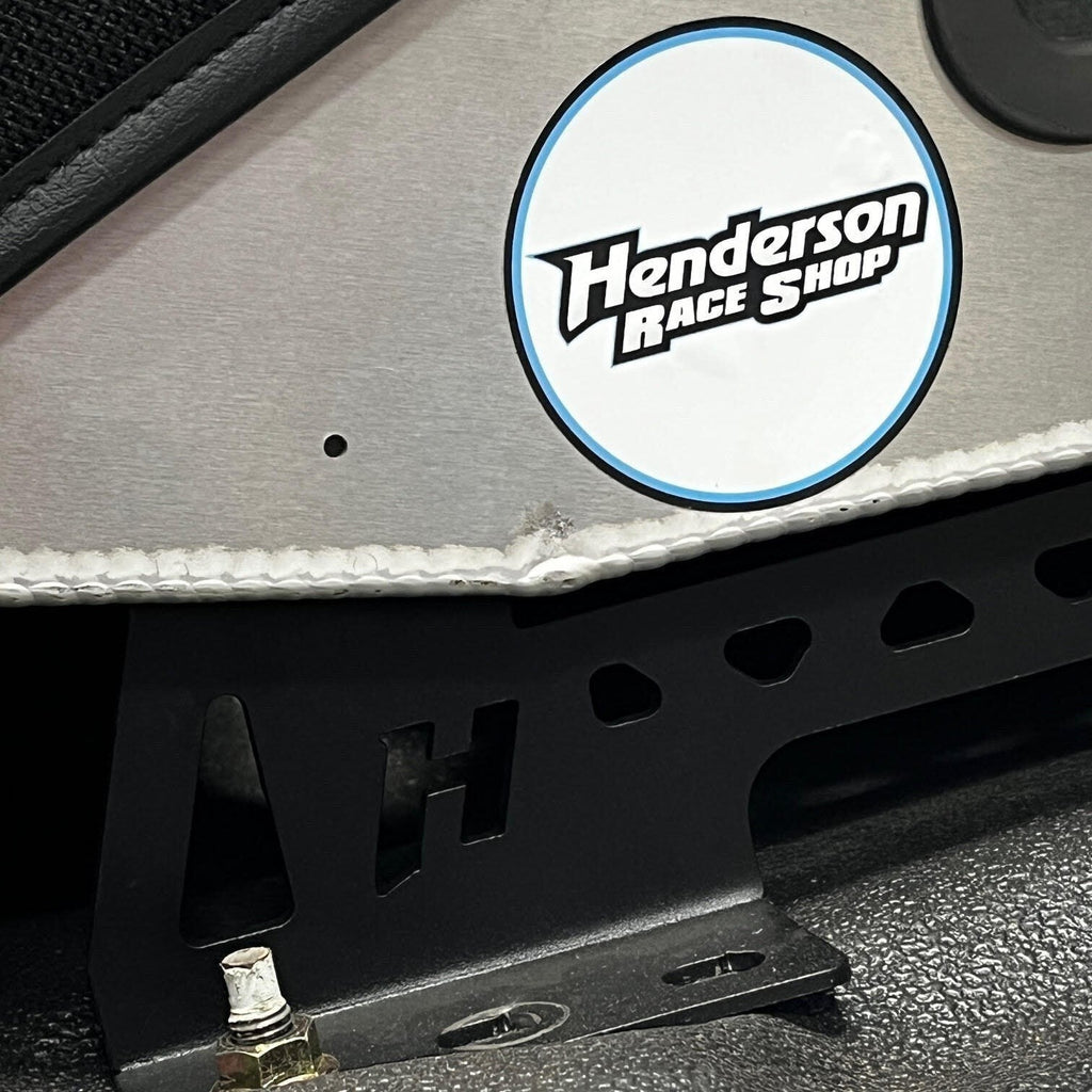 Henderson Race Shop black powder-coated steel seat mount bracket installed under a Kirkey racing seat