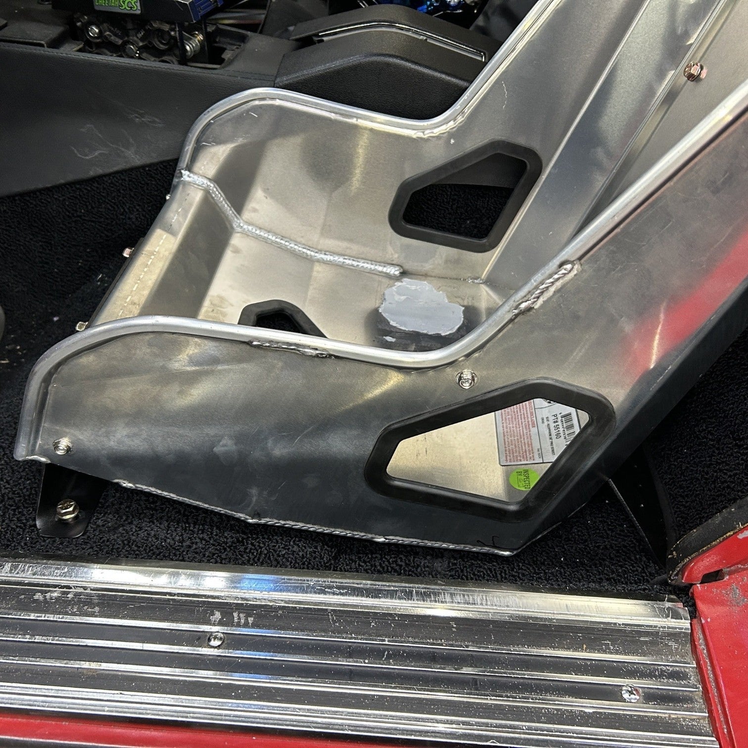 Henderson Race Shop Store Kirkey seat mounts installed in a C3 Corvette with an aluminum racing seat