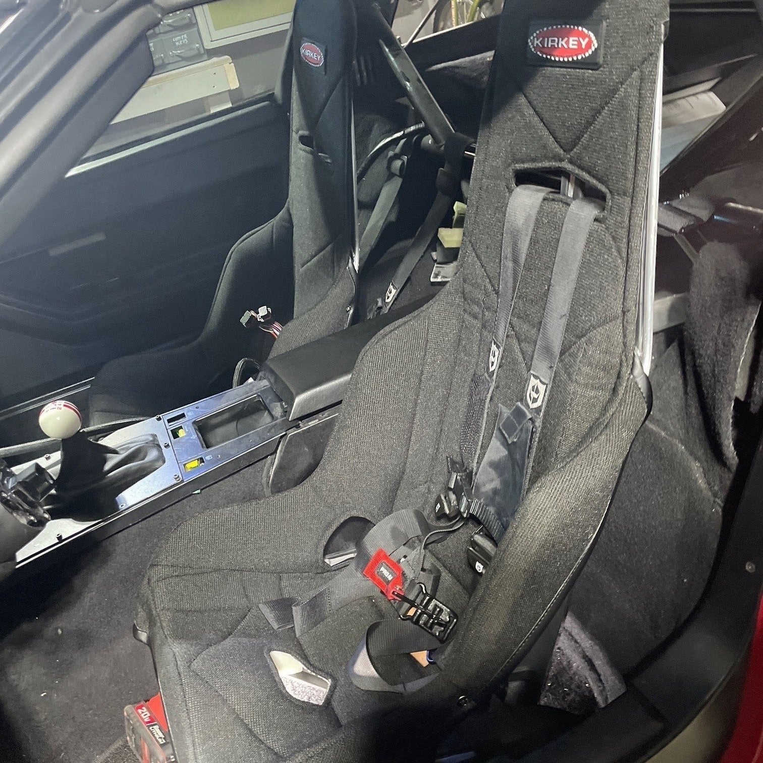 Henderson Race Shop Store seat mounts installed with black Kirkey racing seats in a C4 Chevrolet Corvette interior