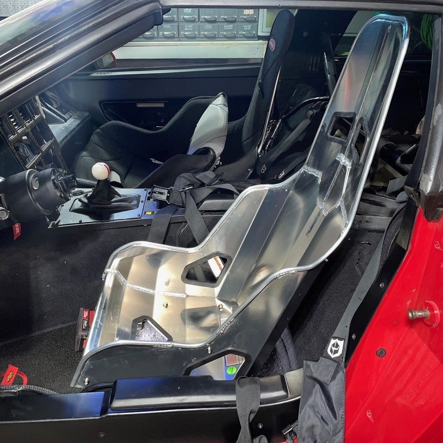 Henderson Race Shop Store seat mounts installed with a Kirkey aluminum racing seat in a C4 Chevrolet Corvette interior