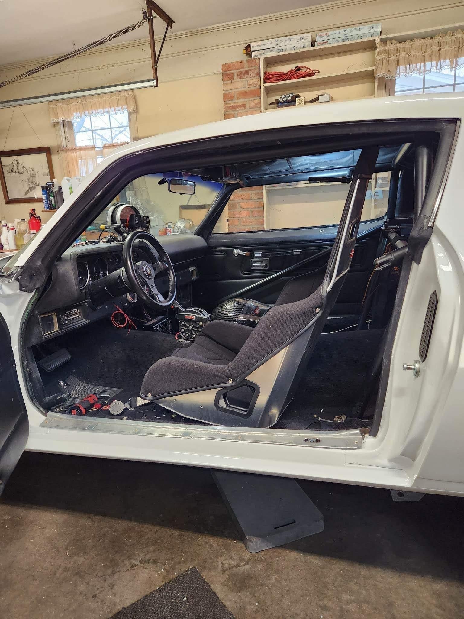 Henderson Race Shop Store seat mounts installed with a Kirkey racing seat in a 1970-1974 Camaro interior