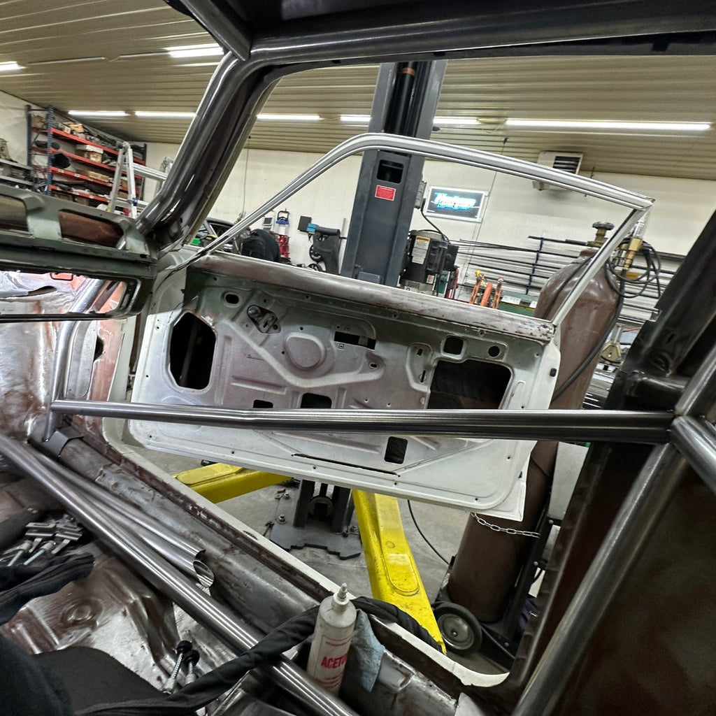Henderson Race Shop Store 8.50 roll cage kit installed in a 1971-1977 Chevy Vega with steel tubing and door bars