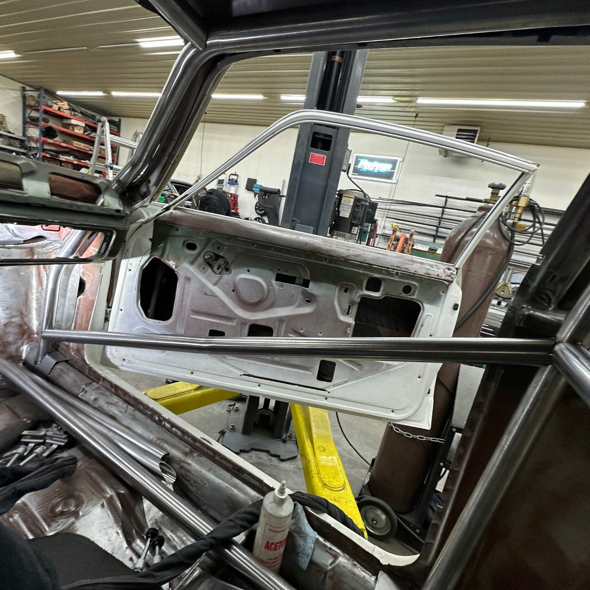 Henderson Race Shop Store 8.50 roll cage kit installed in a 1971-1977 Chevy Vega with steel tubing and door bars