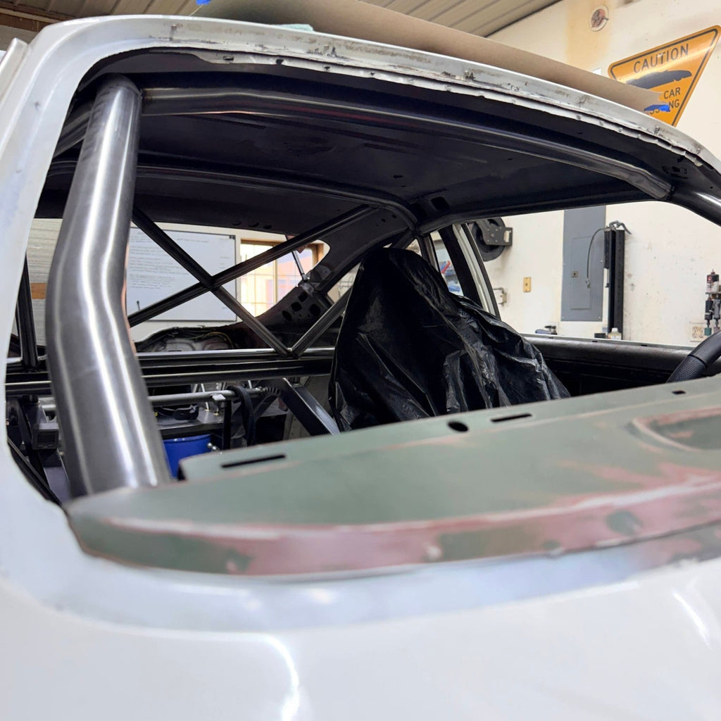 Henderson Race Shop Store 8.50 roll cage installed in a 1971-1977 Chevy Vega with precision-fit chromoly tubing.