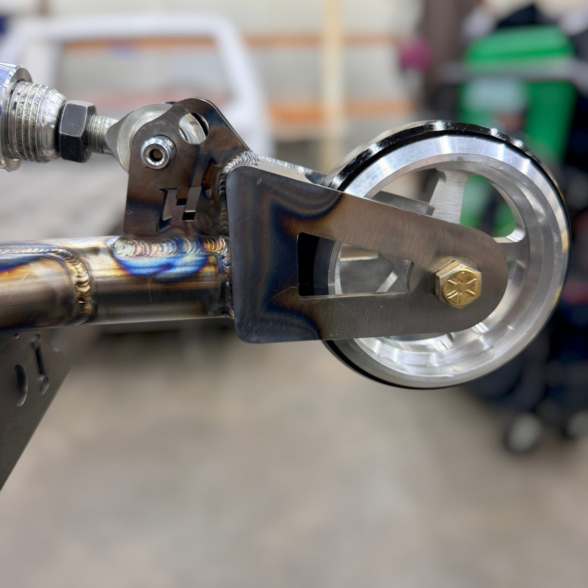 Henderson Race Shop Store chromoly wheelie bar with spring-loaded slider assembly and machined aluminum wheel