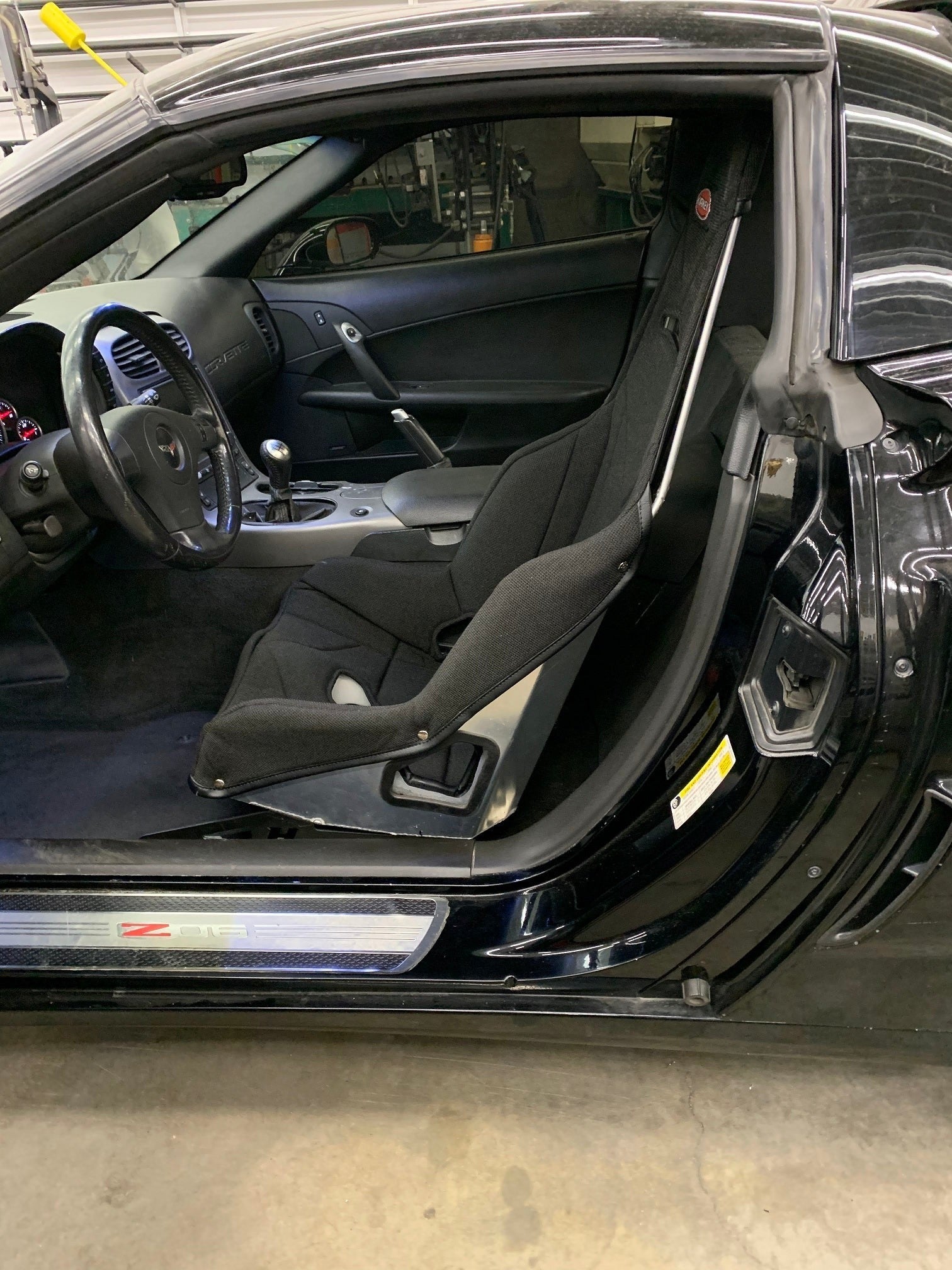 Henderson Race Shop Store seat mount installed with a Kirkey racing seat inside a Chevrolet Corvette interior