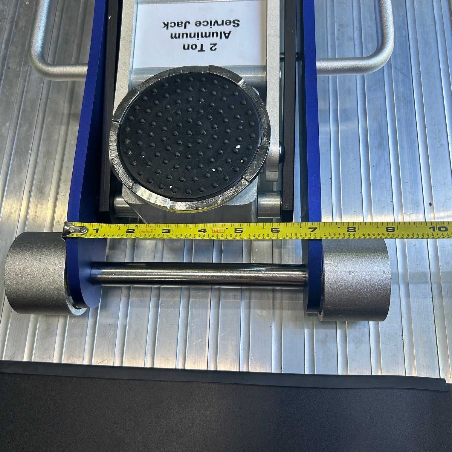 Henderson Race Shop Store floor jack pad measuring 9 inches wide on a 2-ton aluminum service jack