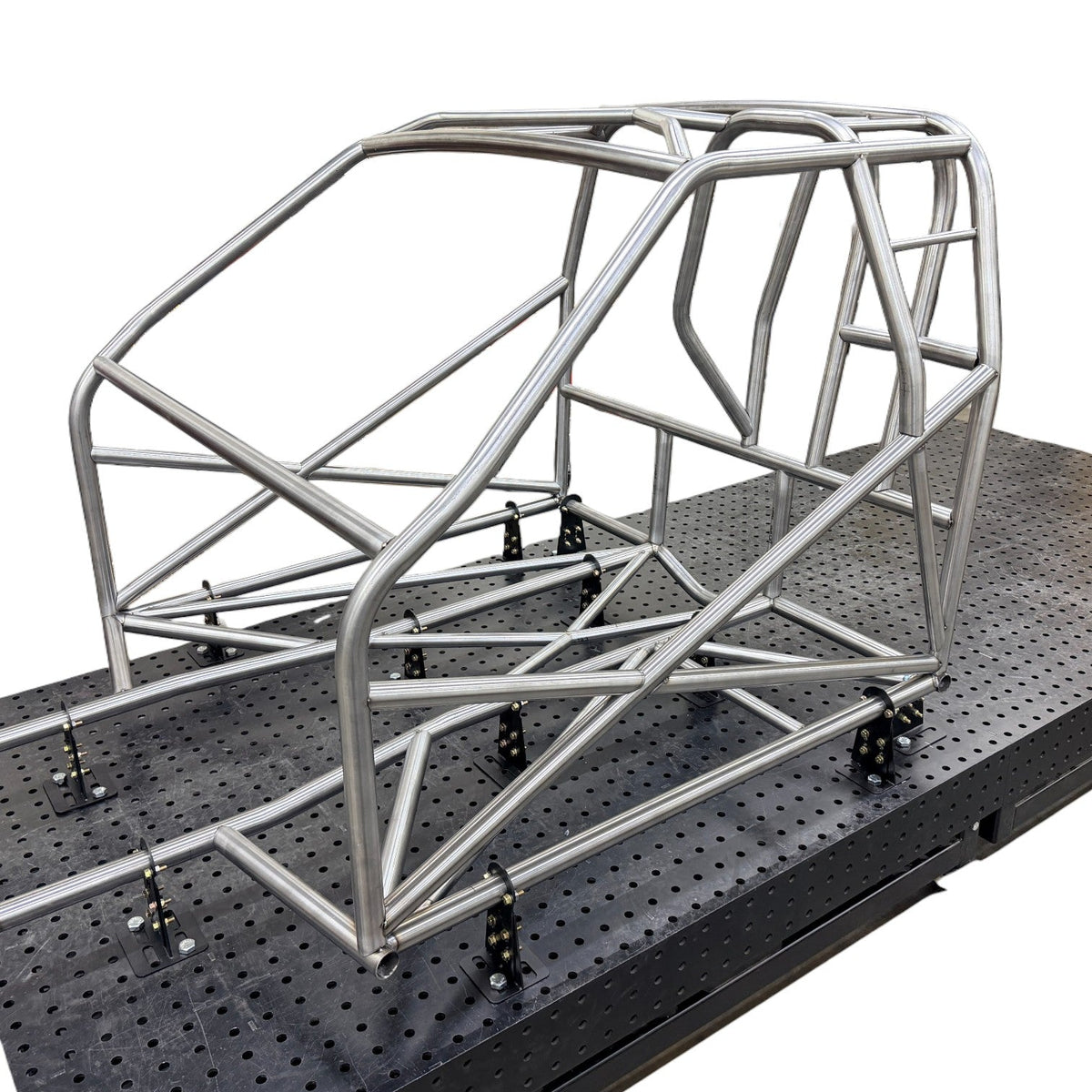 Henderson Race Shop Store 25.2 chromoly roll cage kit for 1979-1993 Fox Body Mustang on a welding fixture table