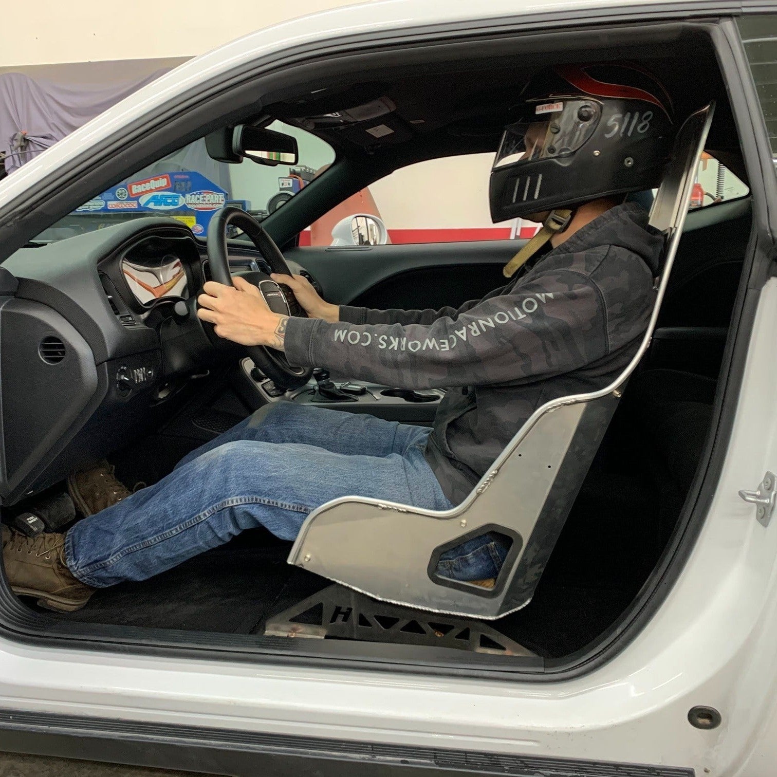 Henderson Race Shop Store seat mount installed with a Kirkey high-back racing seat in a Dodge Challenger interior