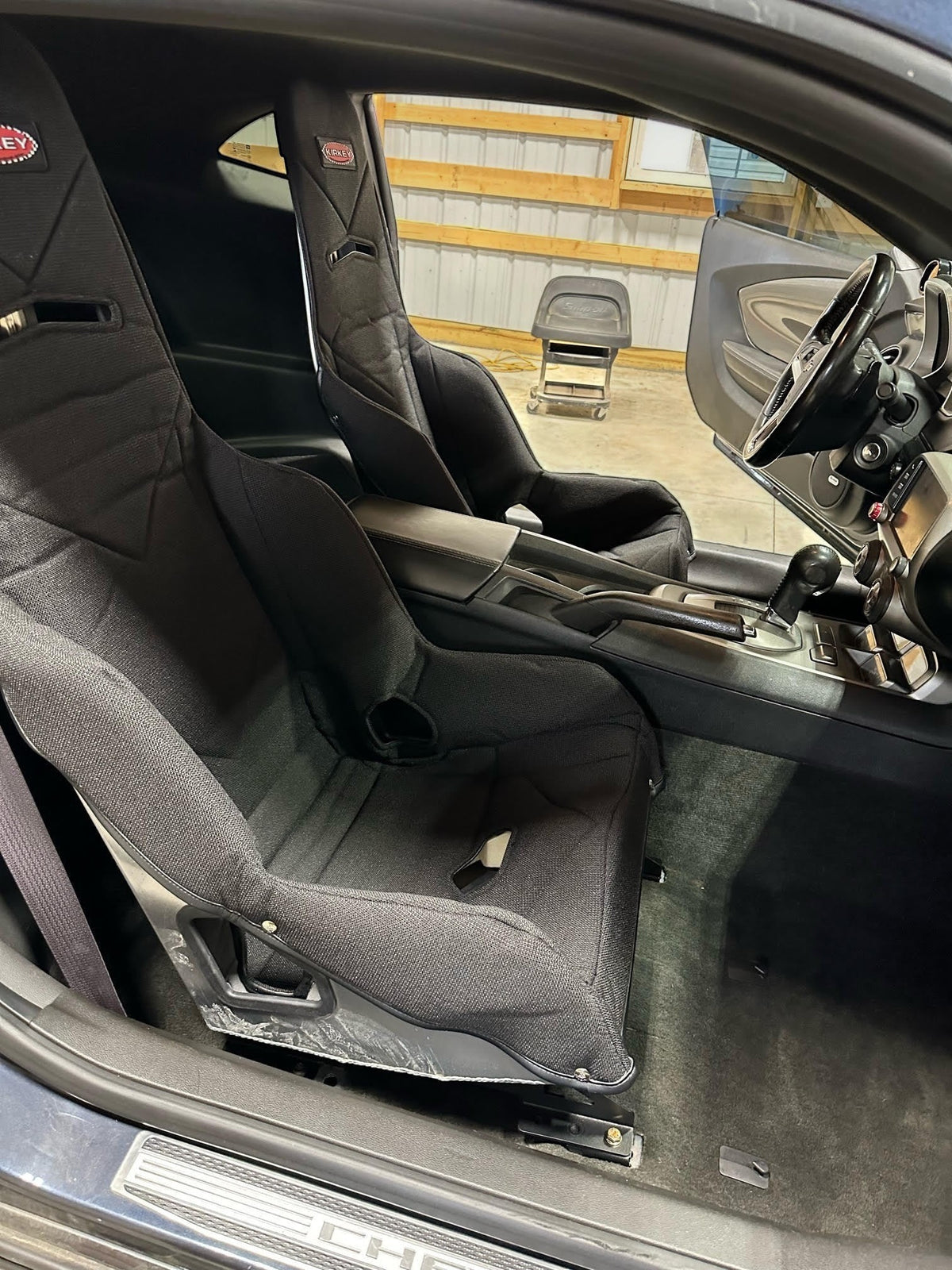 Henderson Race Shop Store Kirkey racing seat installed in a 5th gen Camaro using black steel seat mount brackets