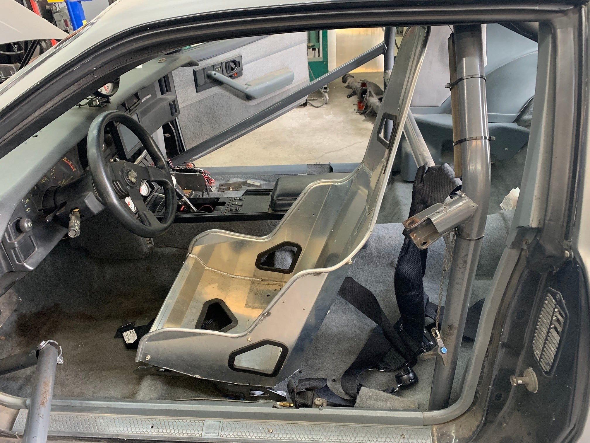 Henderson Race Shop Store seat mounts installed with a Kirkey racing seat inside a Camaro or Firebird interior