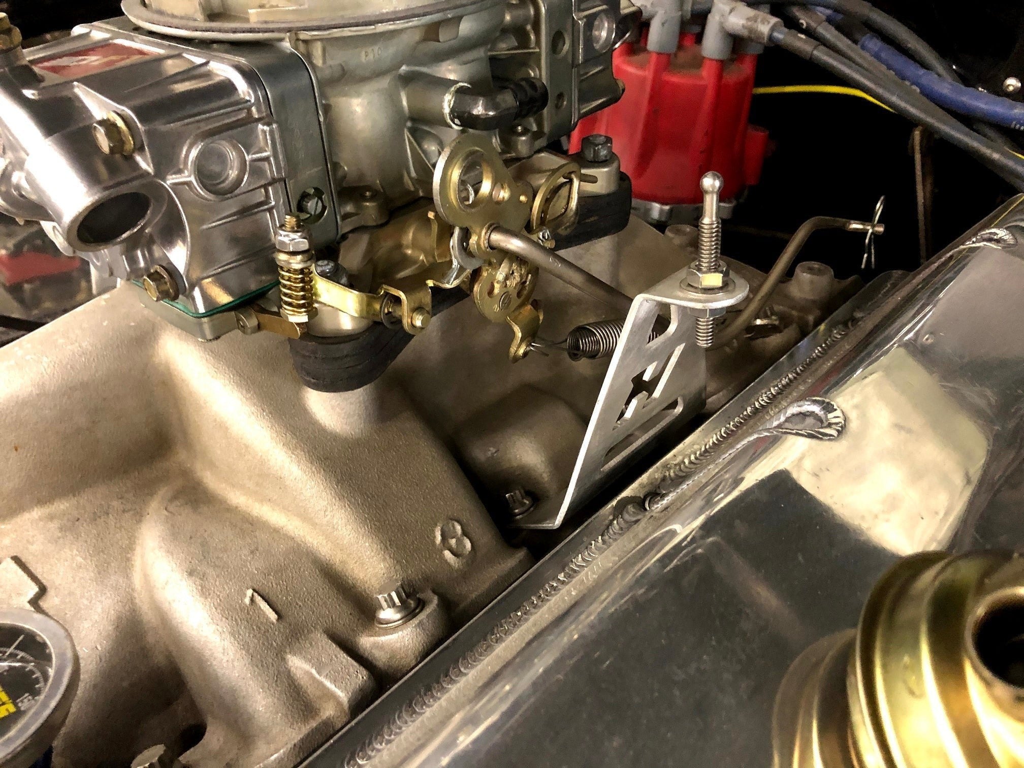 Henderson Race Shop Store NHRA legal carburetor base with quick release mounting bracket installed on an engine intake