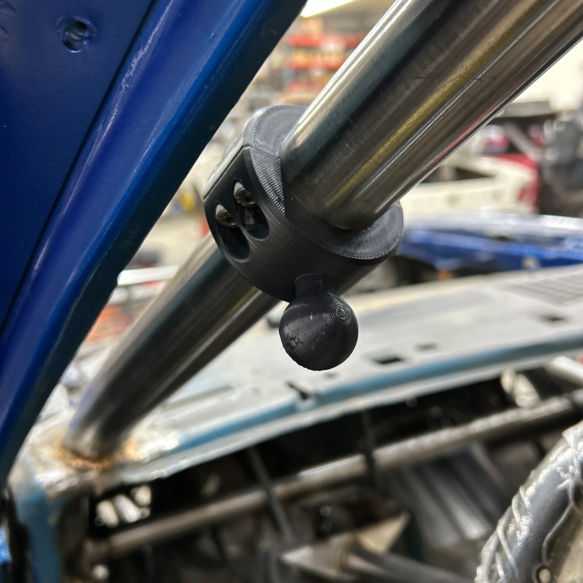 Henderson Race Shop Store black 3D printed roll bar clamp with RAM-style ball mount installed on metal tubing
