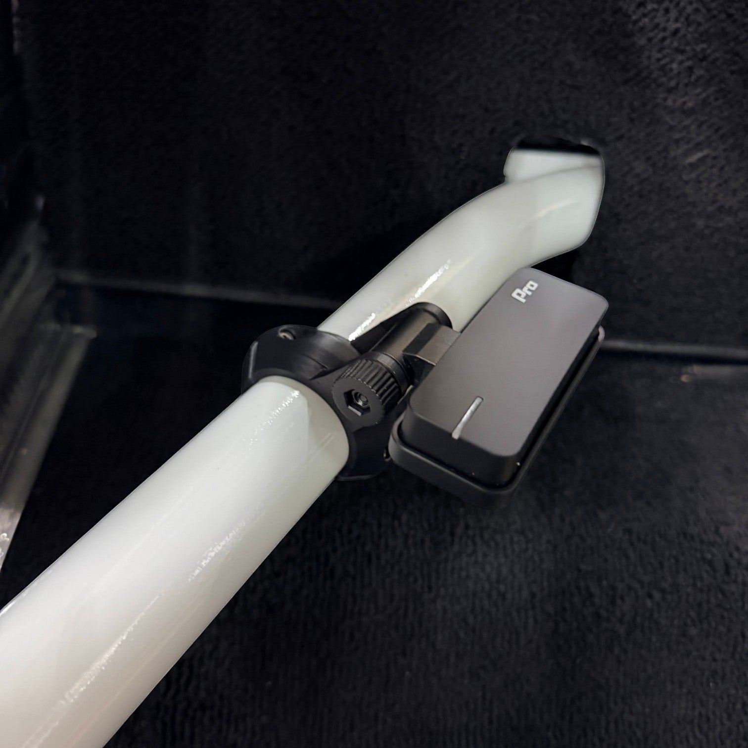 Henderson Race Shop Store 3D printed black roll cage clamp with GoPro fitting mounted on a white roll bar