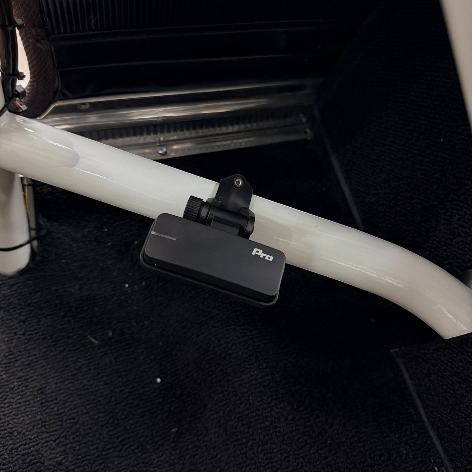 Henderson Race Shop Store 3D printed black roll cage clamp with GoPro fitting mounted on a white roll bar