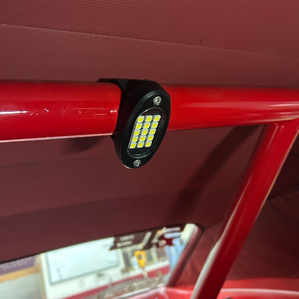 Henderson Race Shop Store 15-SMD LED light mounted on a red race car roll cage with a durable ASA clamp