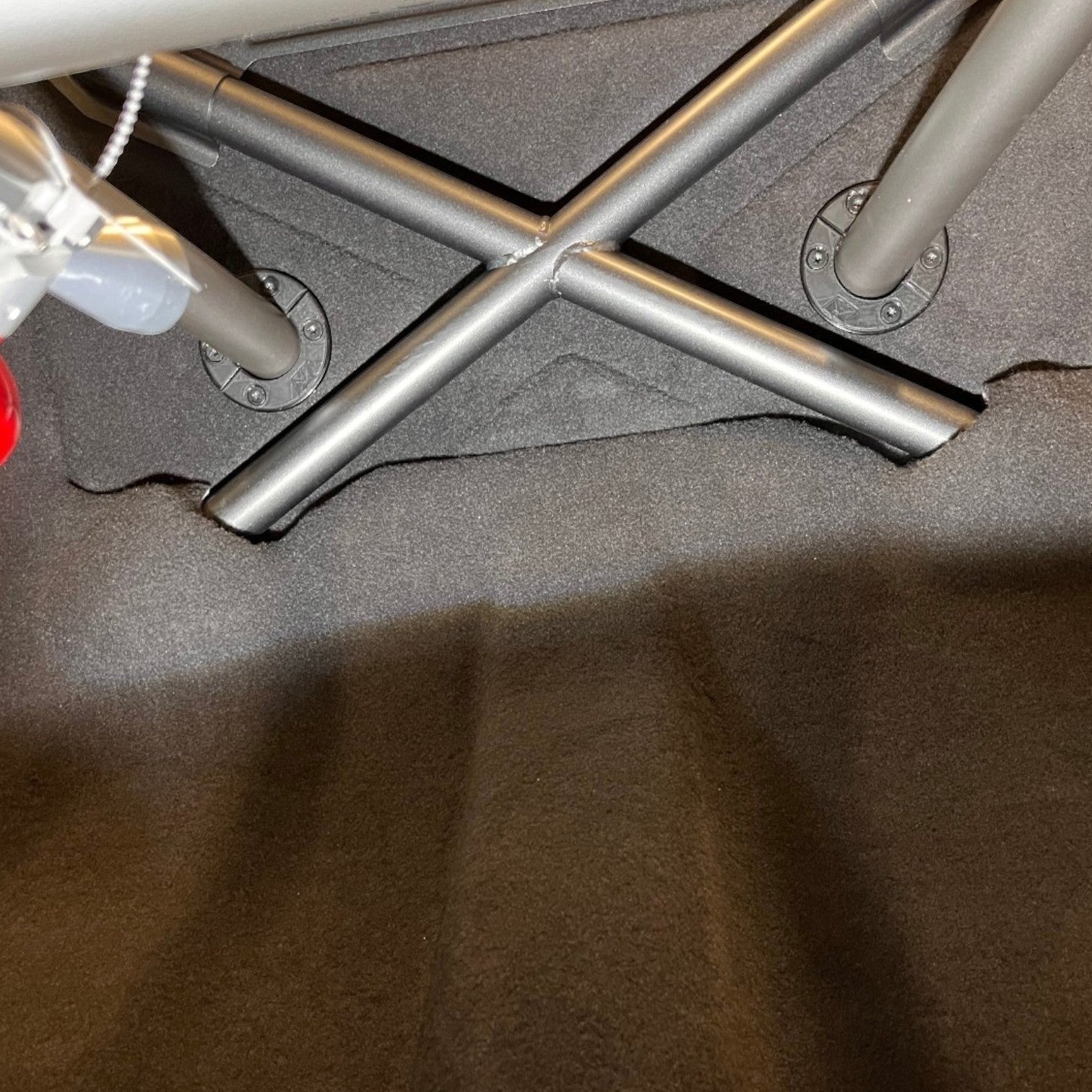 Henderson Race Shop Store roll cage trim plates installed on a rear deck around metal support bars
