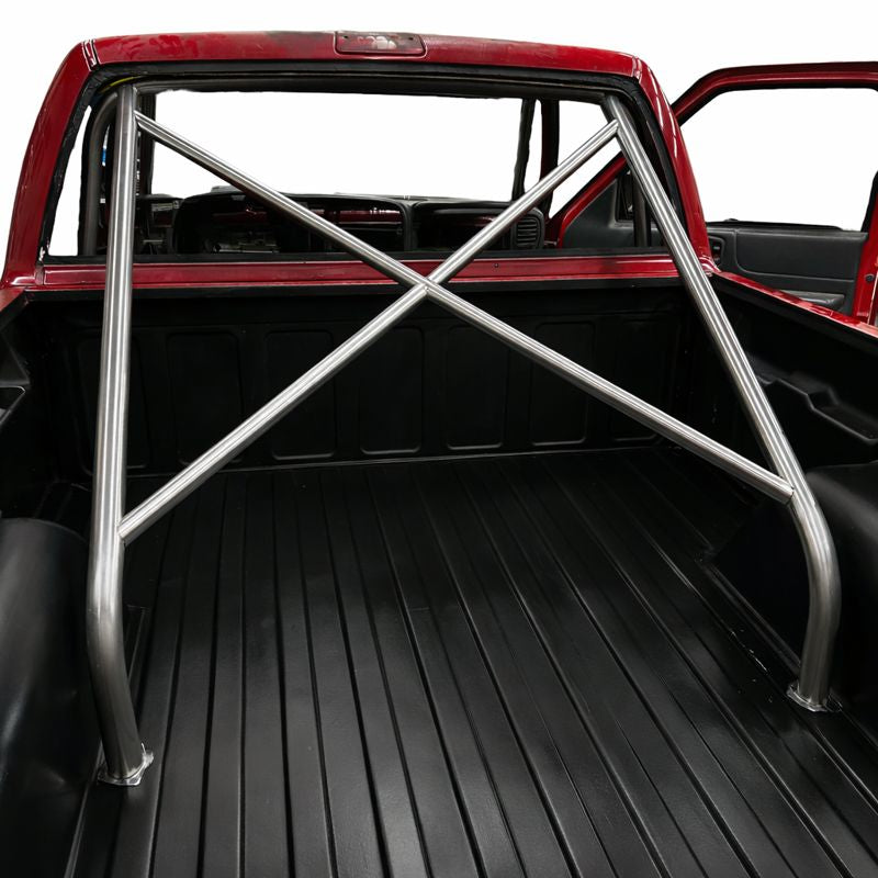 Henderson Race Shop Store 8.50 chromoly roll cage installed in the bed of a red S10 truck with X-brace design