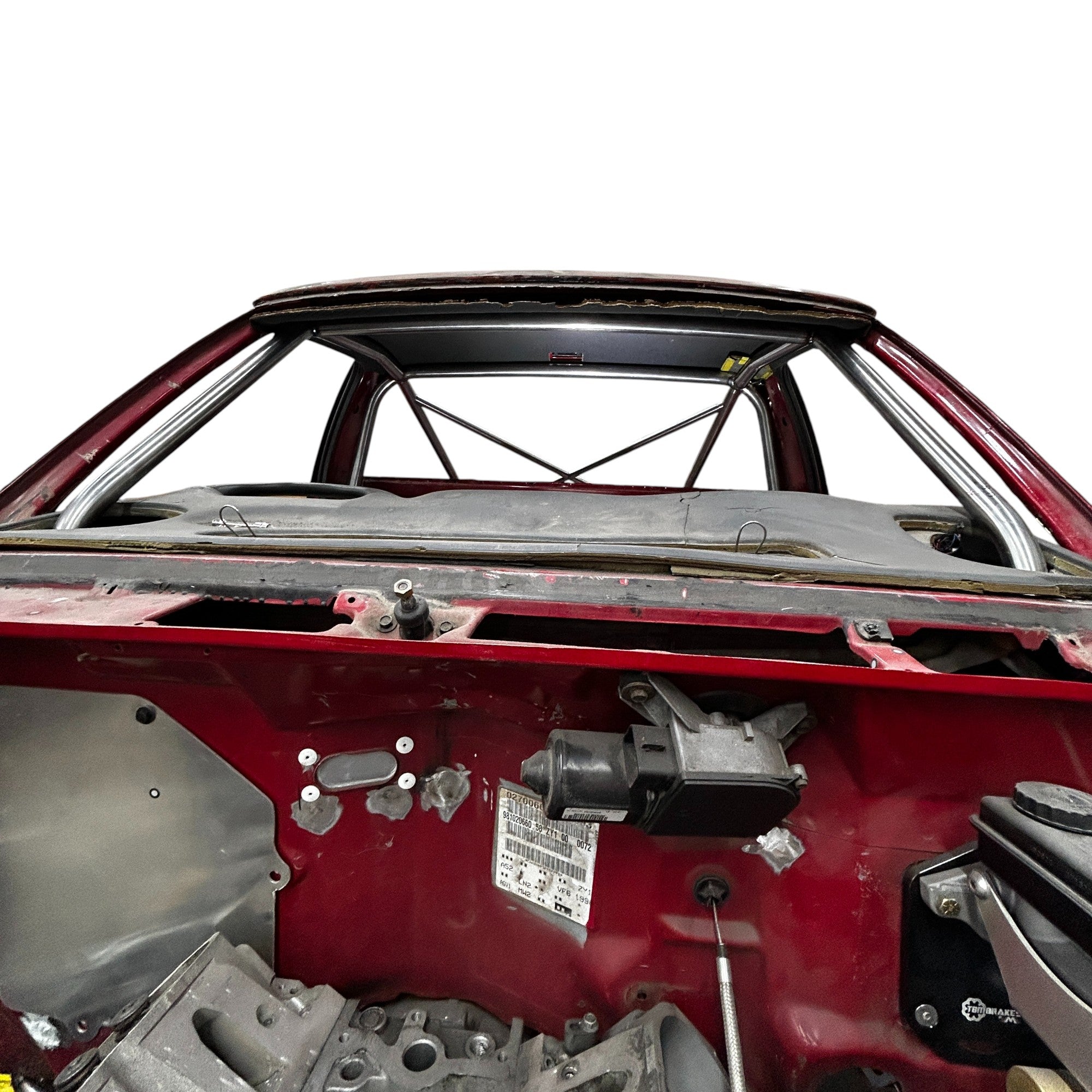 Henderson Race Shop Store 8.50 chromoly roll cage installed in a red S10 truck with A-pillar bars routed through dash.