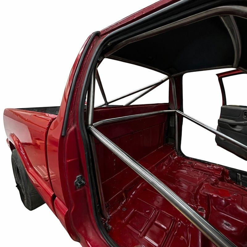 Henderson Race Shop Store 8.50 chromoly roll cage installed in a red S10 truck with A-pillar bars behind the dash