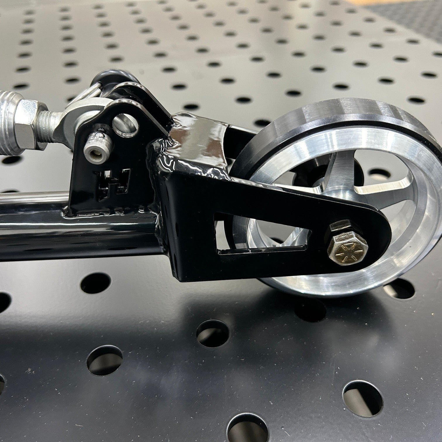 Henderson Race Shop Store single wheelie bar featuring a black powder-coated chromoly frame and heavy-duty wheel.