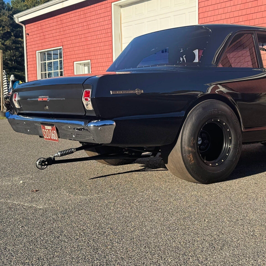 Henderson Race Shop Store single wheelie bar with heavy duty spring slider installed on a black drag racing car